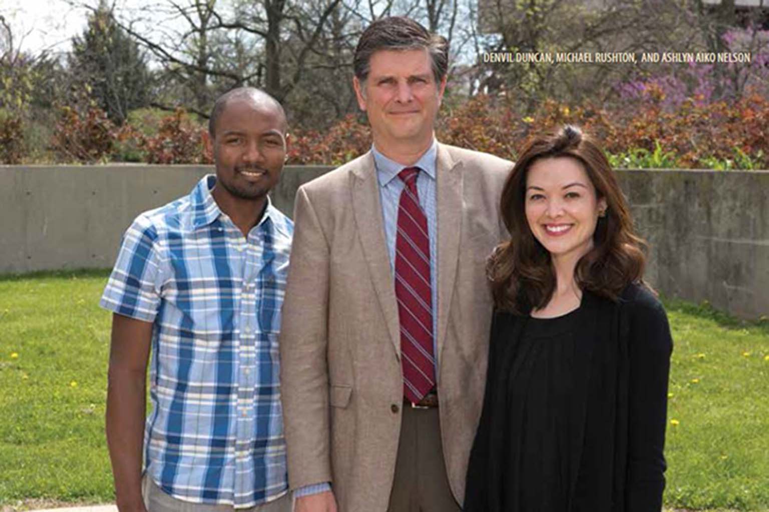 Denvil Duncan, Michael Rushton, and Ashly Aiko Nelson stand in the sunshine in the former SPEA plaza.